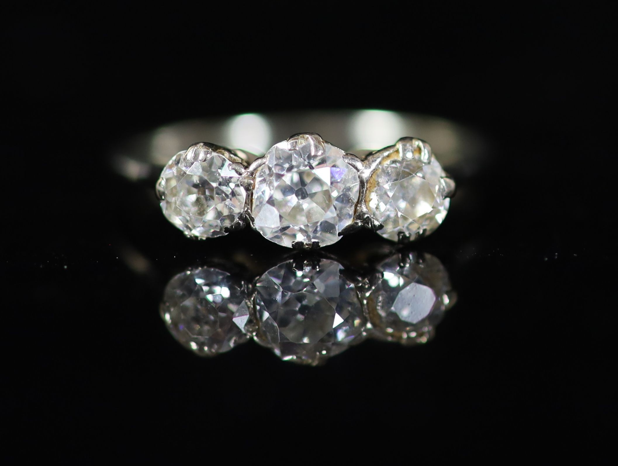 A white gold and three stone diamond set ring